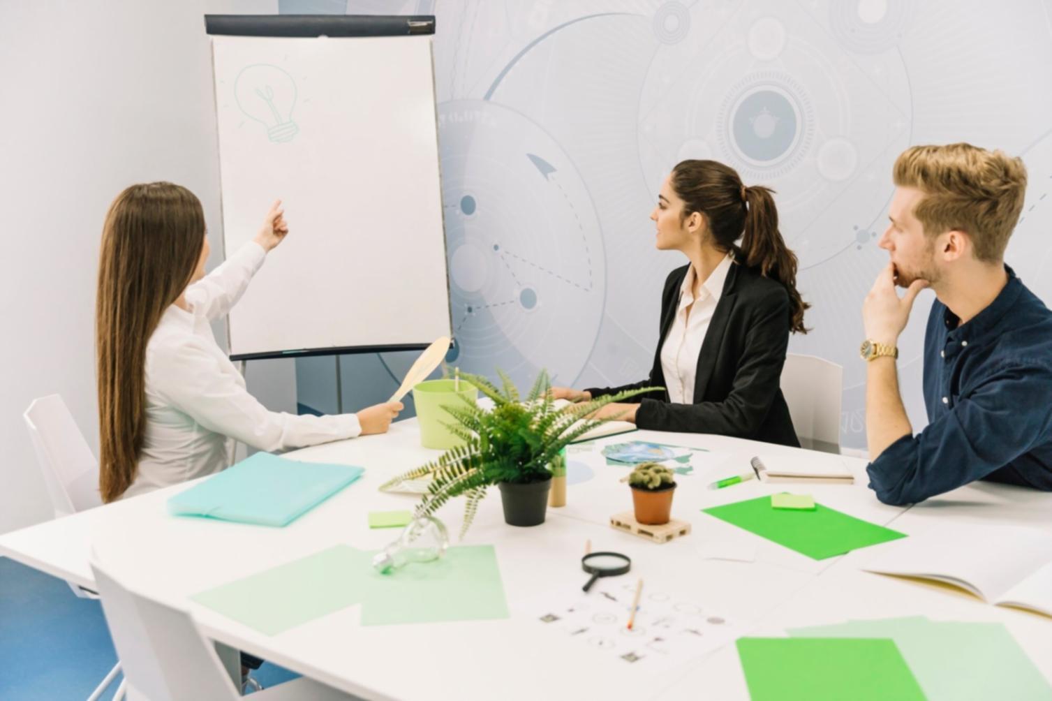 Modern family discussing finances using tablet and documents